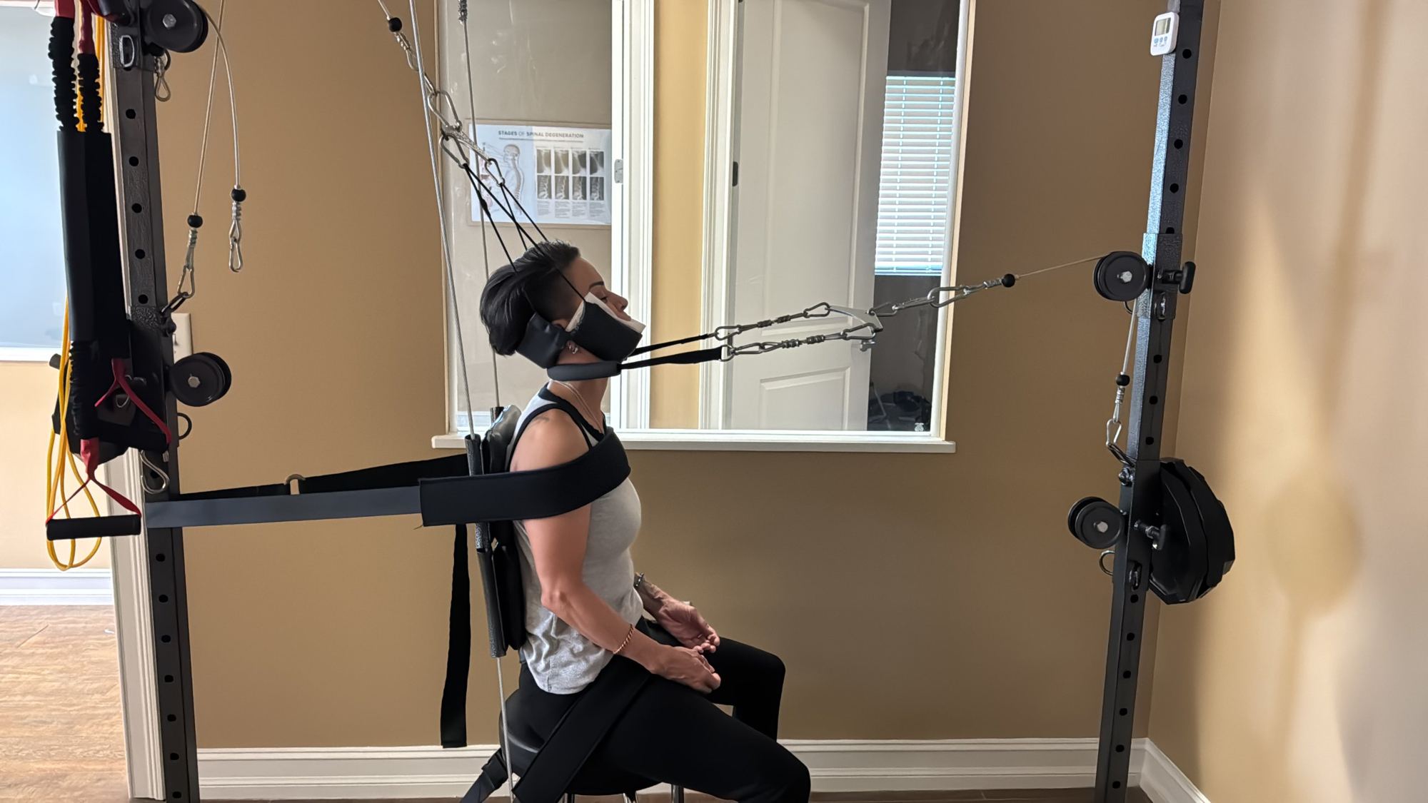 Patient in cervical extension traction at the Longwood office